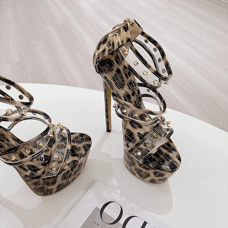 Pair of leopard platform heels with clear straps and studs