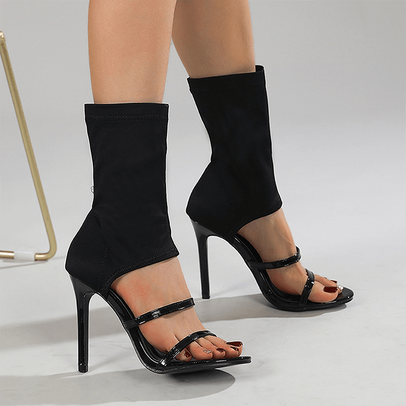 Black open toe stretch sock boot heels worn from front
