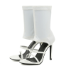 Pair of white open toe sock boot stilettos isolated