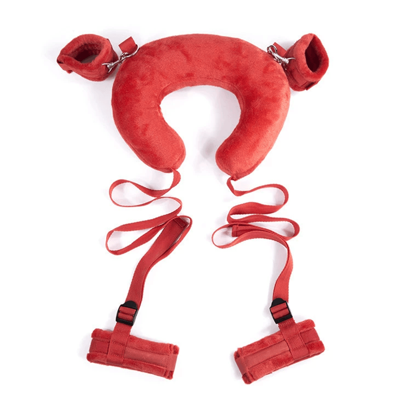 Red padded restraint pillow with cuff styling