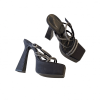 Pair of black rhinestone strappy platform heels in isolated view