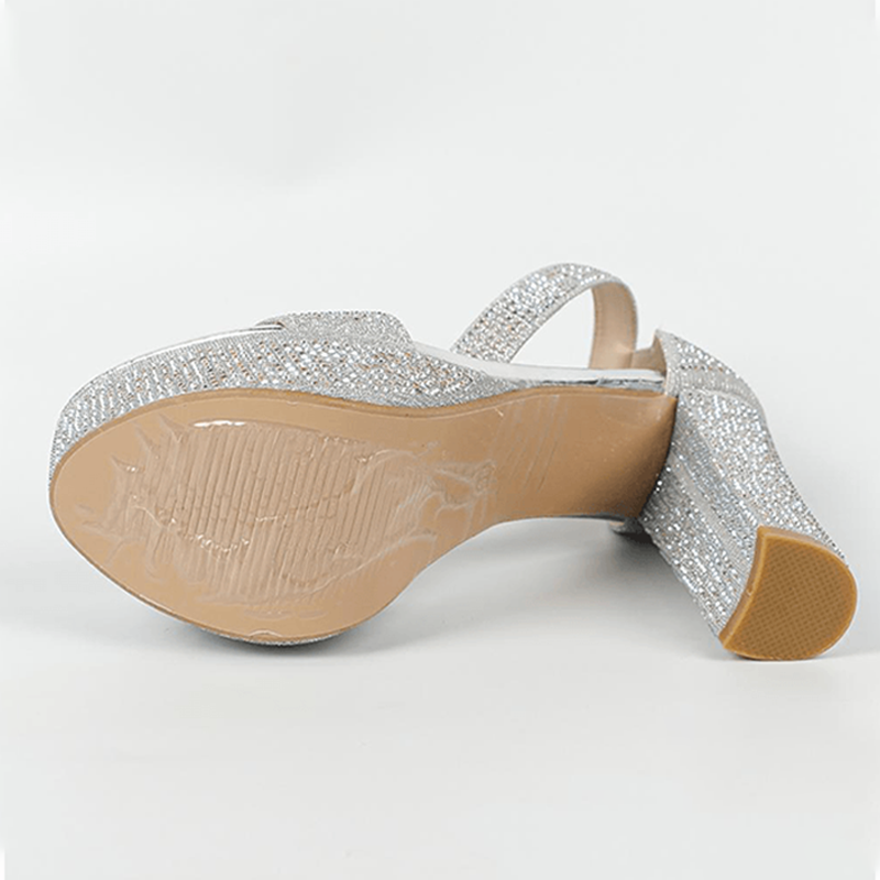 Silver block heel sandal outsole and heel detail